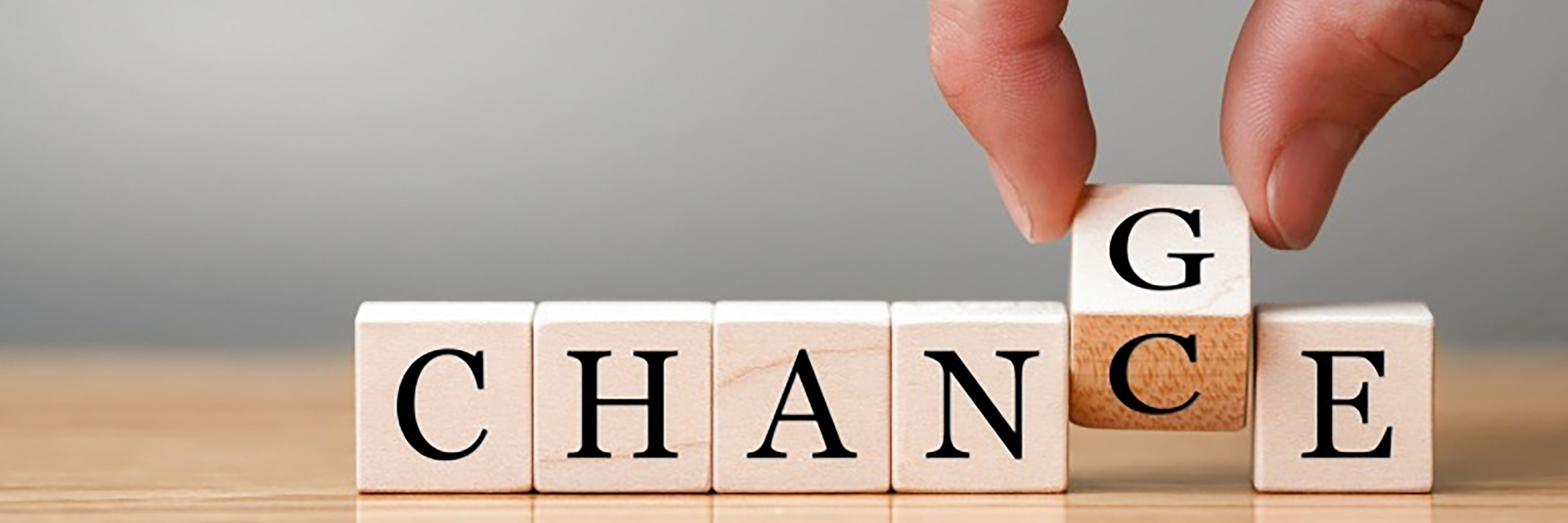 A photo of wooden blocks spelling CHANGE